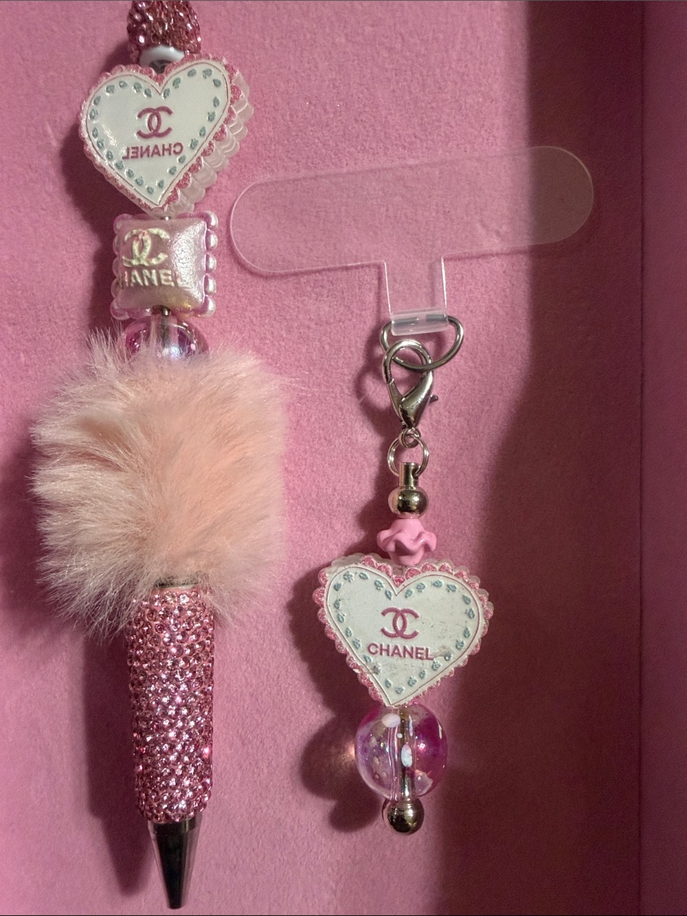 Pink beaded fluffy rhinestone pen with matching phone charm and attachment.
